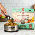 Primal Freeze-Dried Chicken Pronto Dog Food, Lifestyle Image of Green Packaging of Freeze-Dried Raw Pronto Chicken Recipe
